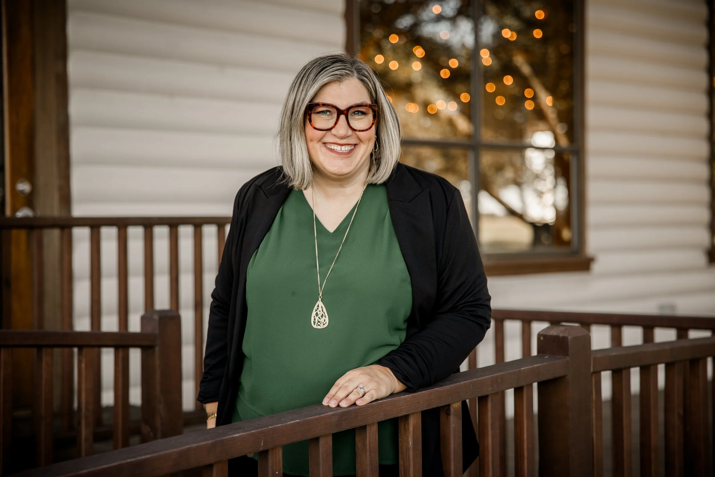 image Founder, Lindsee Sanchez, a woman standing in front of railing