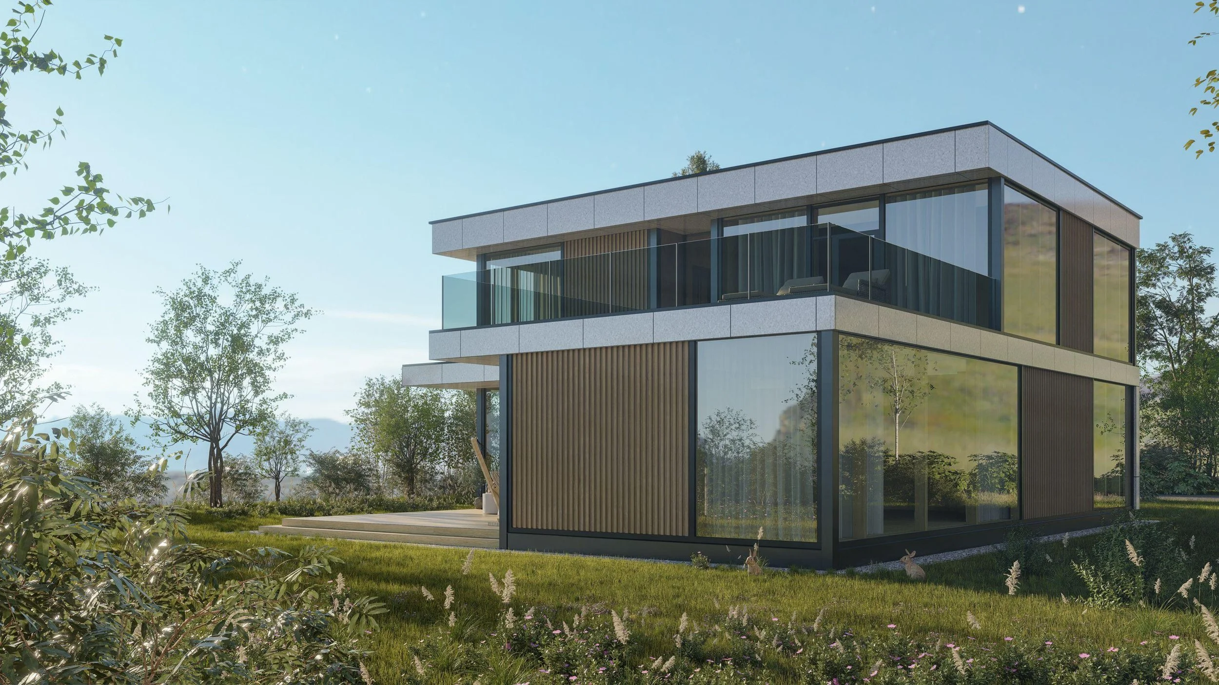 Modern multi-story house with large glass windows and a balcony surrounded by trees and a lush yard.