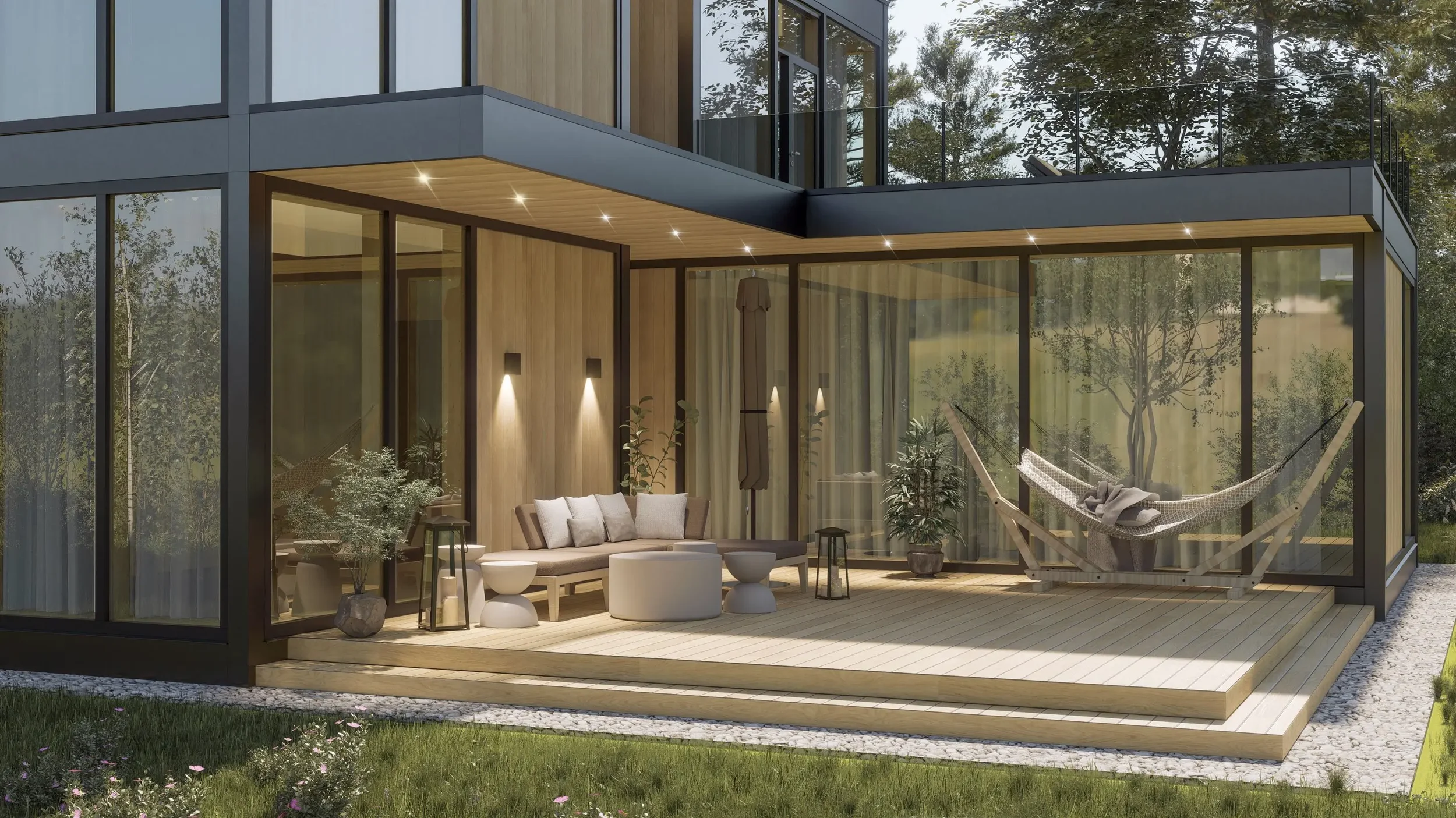 Modern outdoor patio with glass walls, wooden ceiling, and outdoor furniture including a sofa, small tables, and a hanging hammock chair, surrounded by trees and greenery.