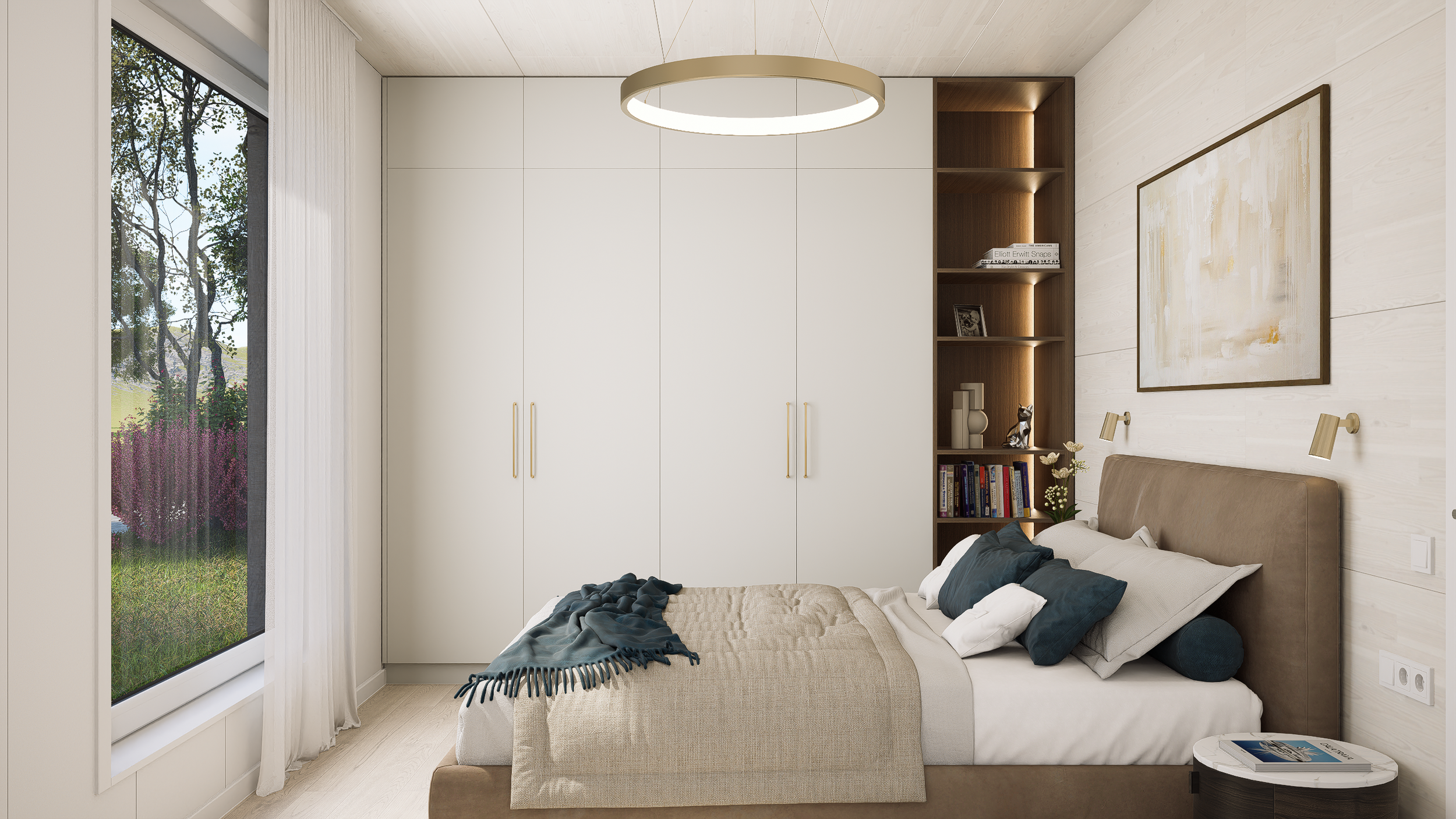 A modern bedroom with a large window showing trees outside. The bed has beige bedding with dark pillows and a blanket. There is a built-in wardrobe with white doors and gold handles, and a wooden shelf with books and decorative items. A framed abstract painting hangs above the bed, and small wall-mounted lamps are beside it.
