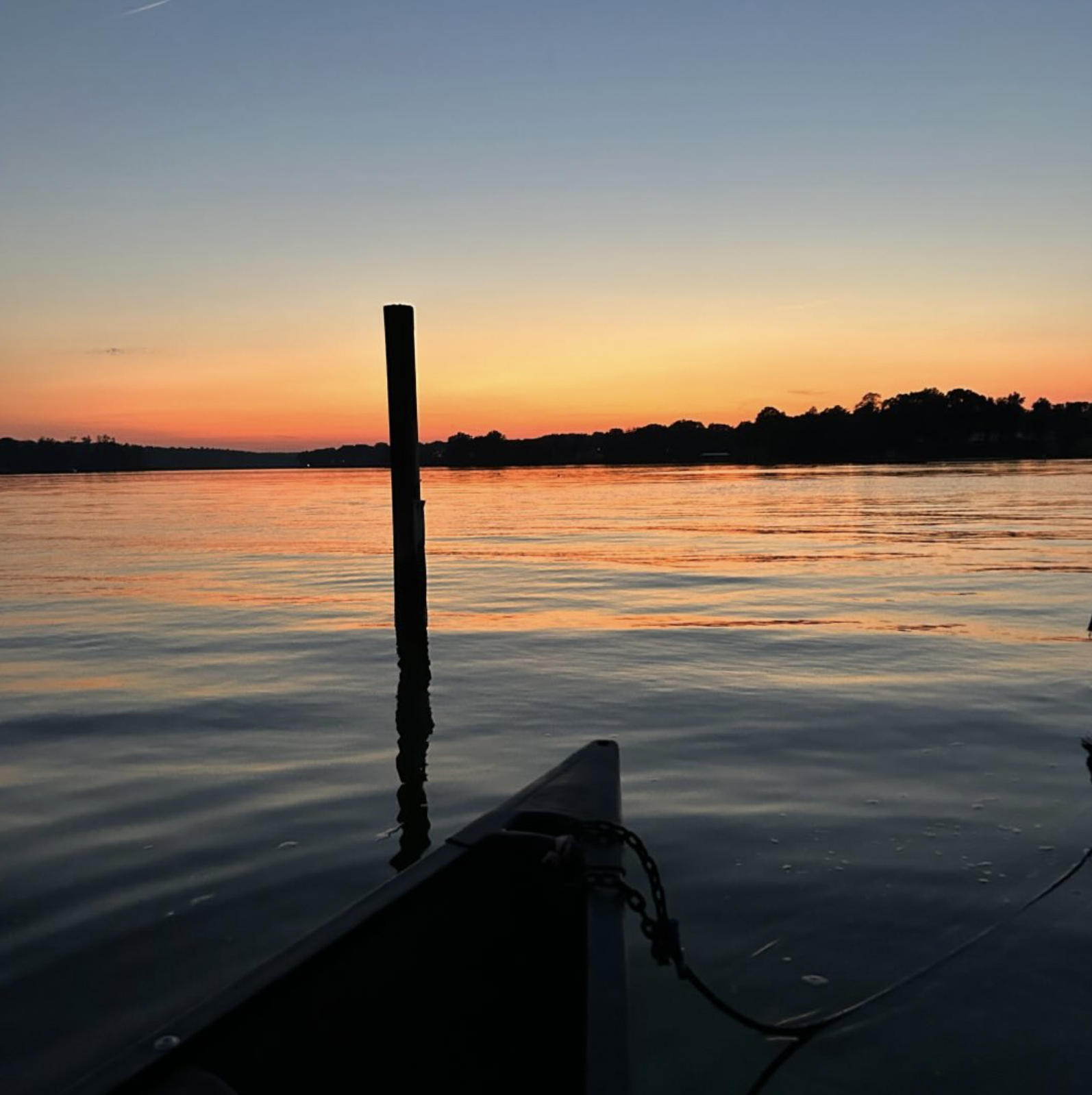 Sunset over the calm water.