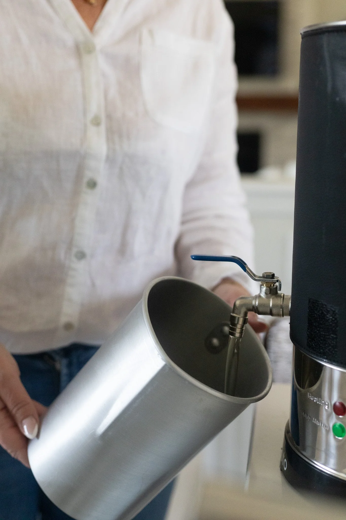 hand pouring coconut wax.jpg