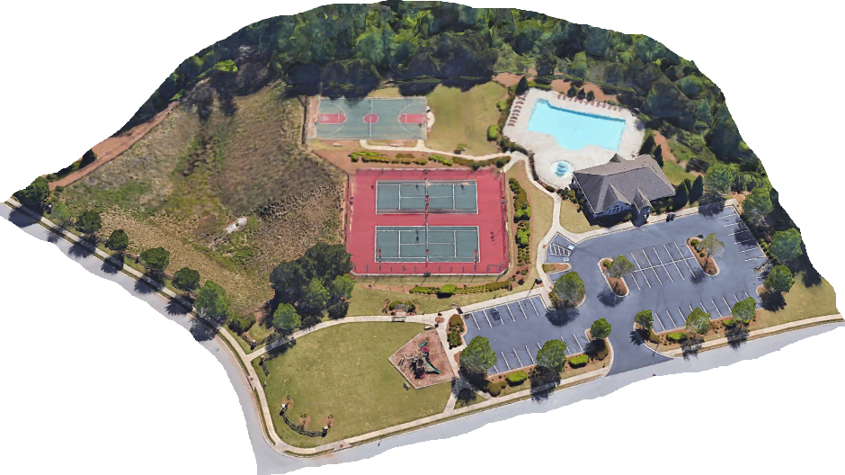 Aerial view of a recreational area with tennis courts, a swimming pool, a building, and a parking lot surrounded by trees.