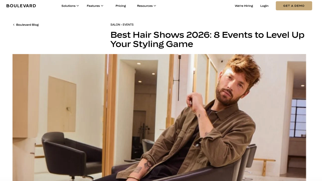 Hairstylist sitting in a client chair in a hair salon.