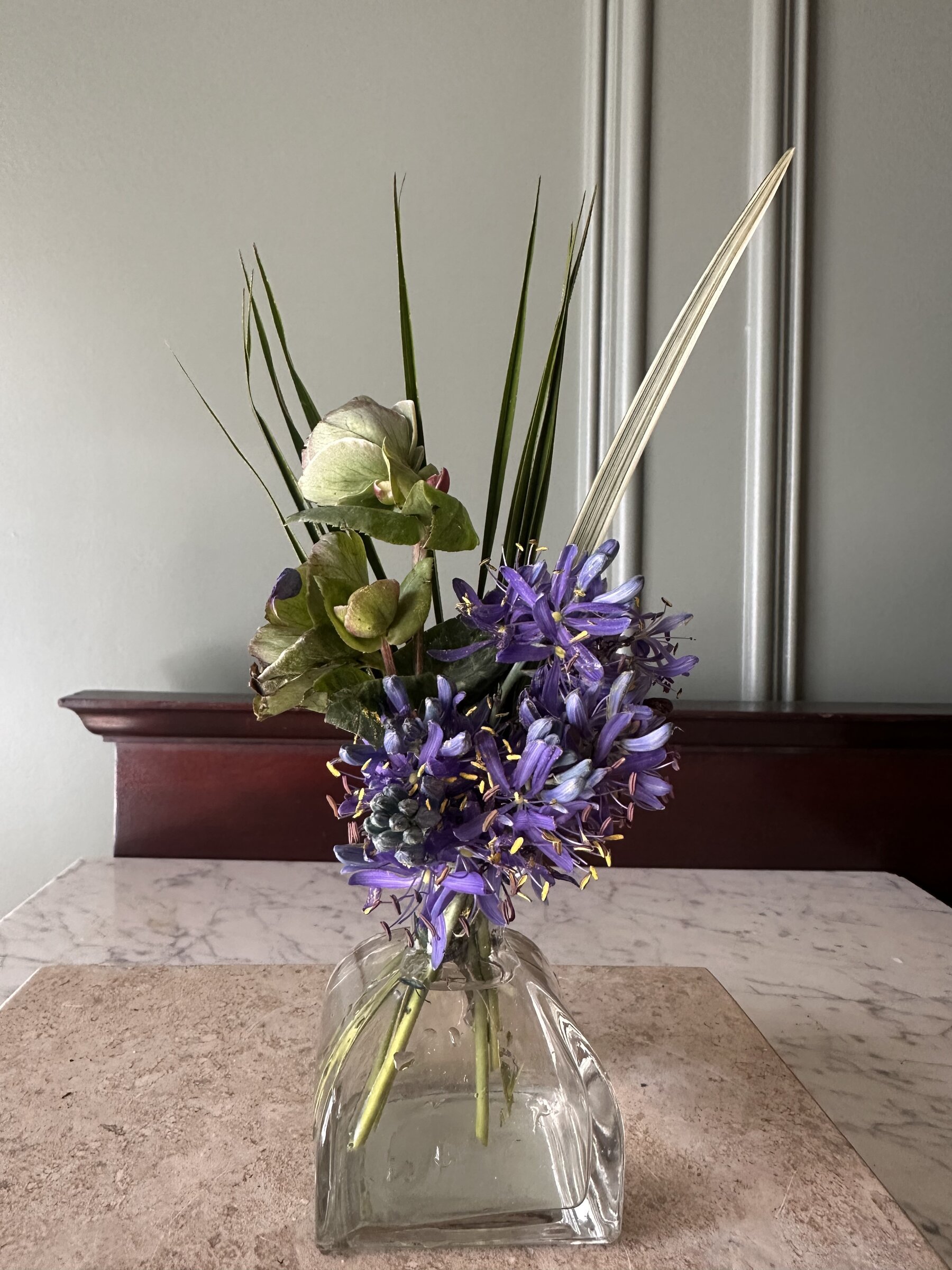 Purple agapanthus and hyacinth arrangement in a glass vase, Botanical Studio by Kelly Eileen.