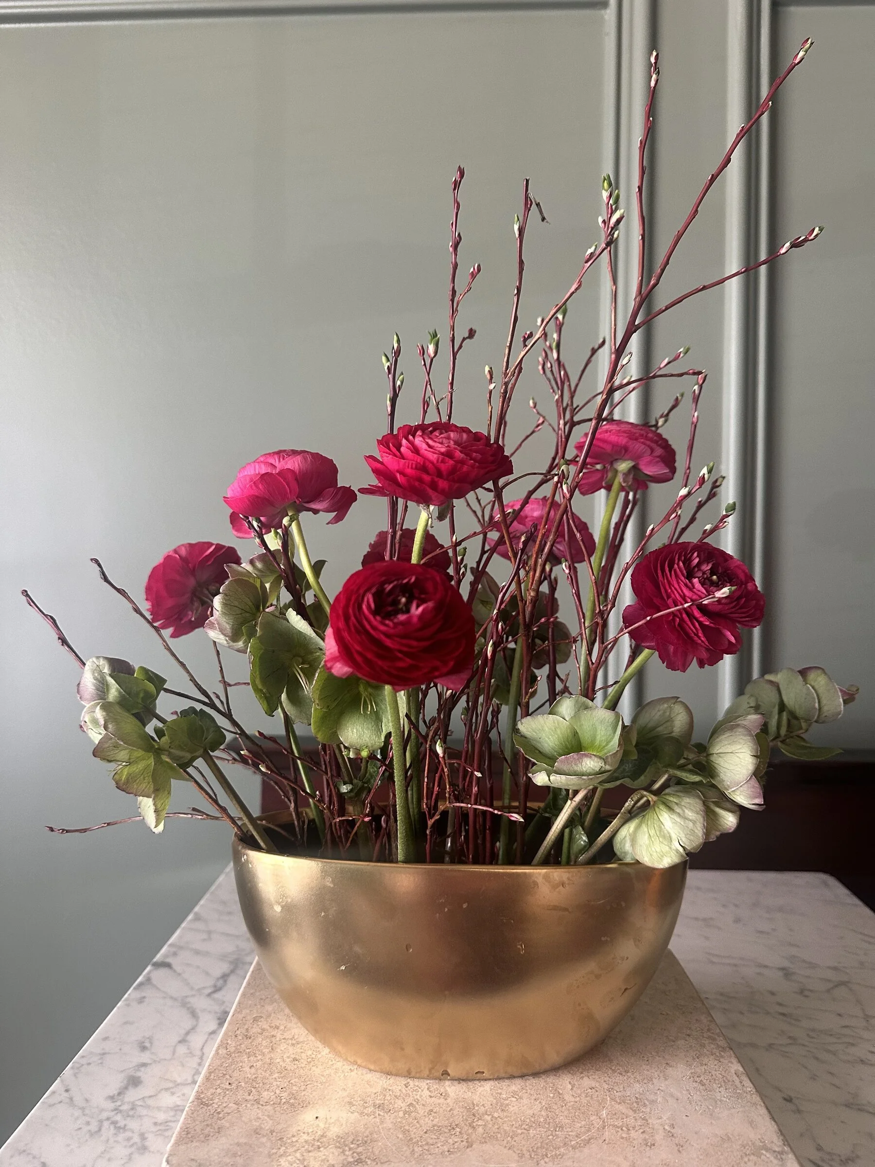 fuchsia-ranunculus-hellebore-branch-arrangement-brass-bowl-raleigh-florist.jpg