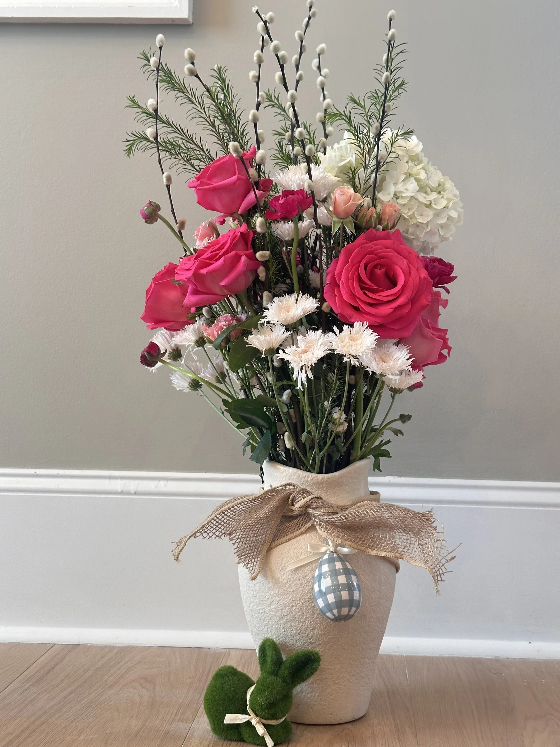 Pink rose and white carnation arrangement with burlap wrap in a white vase, Botanical Studio by Kelly Eileen.