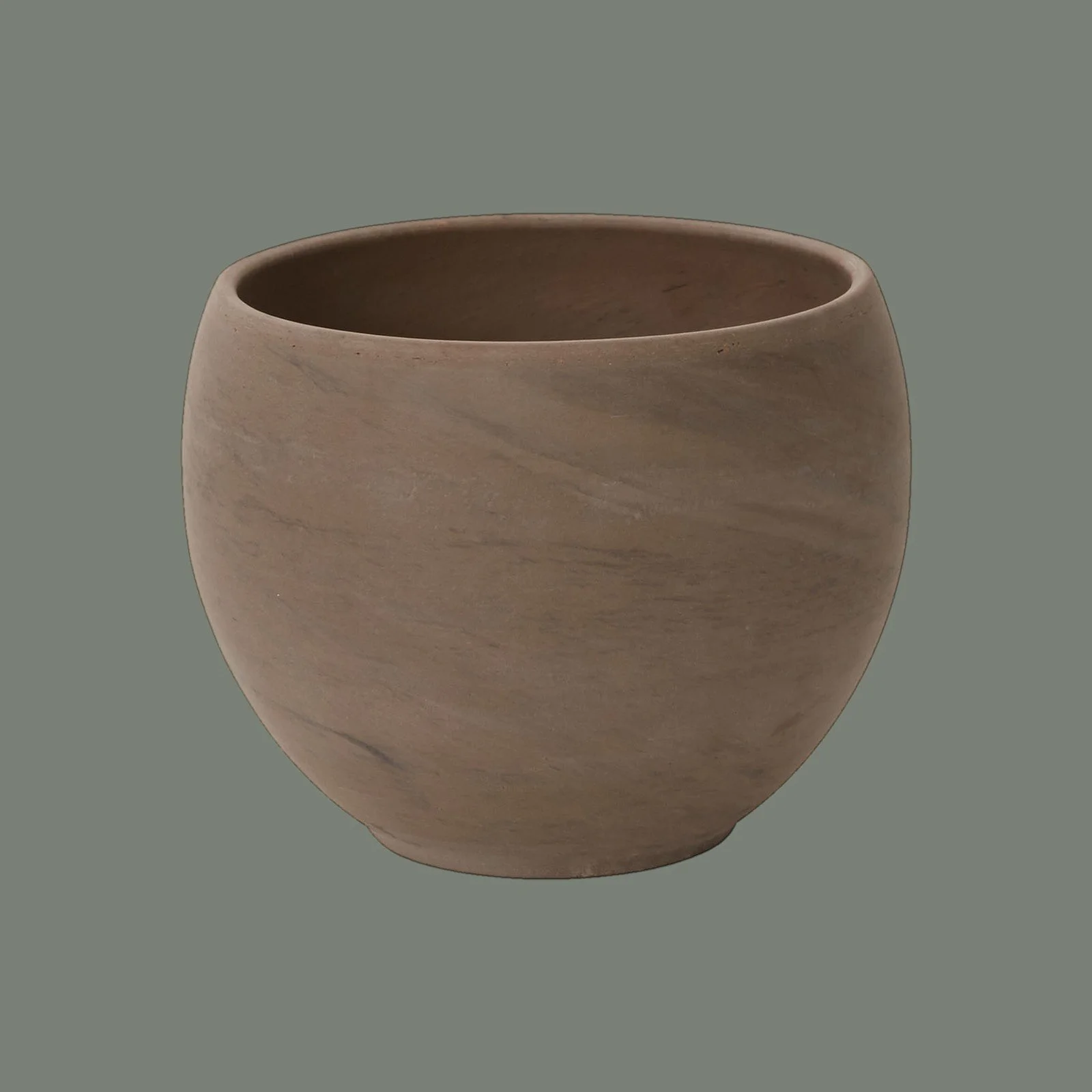 A round, beige ceramic pot with a smooth, matte finish, set against a plain gray background.
