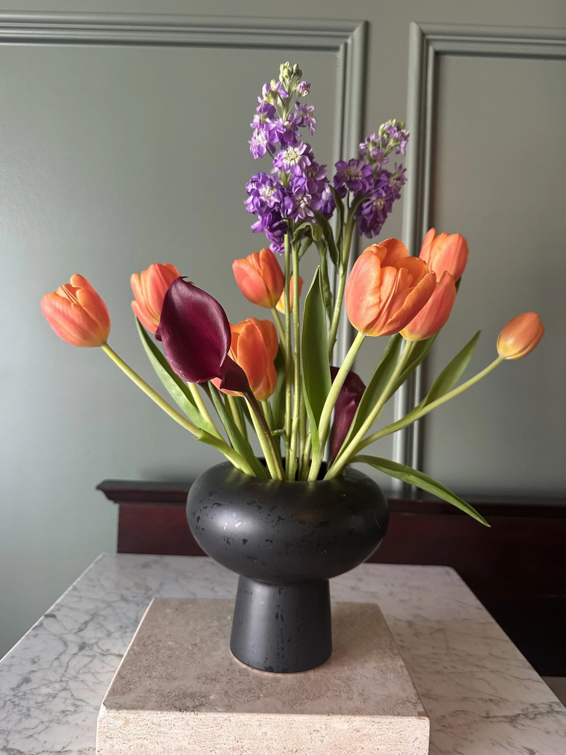 orange-tulip-purple-calla-lily-stock-pedestal-vase-raleigh-florist.jpg