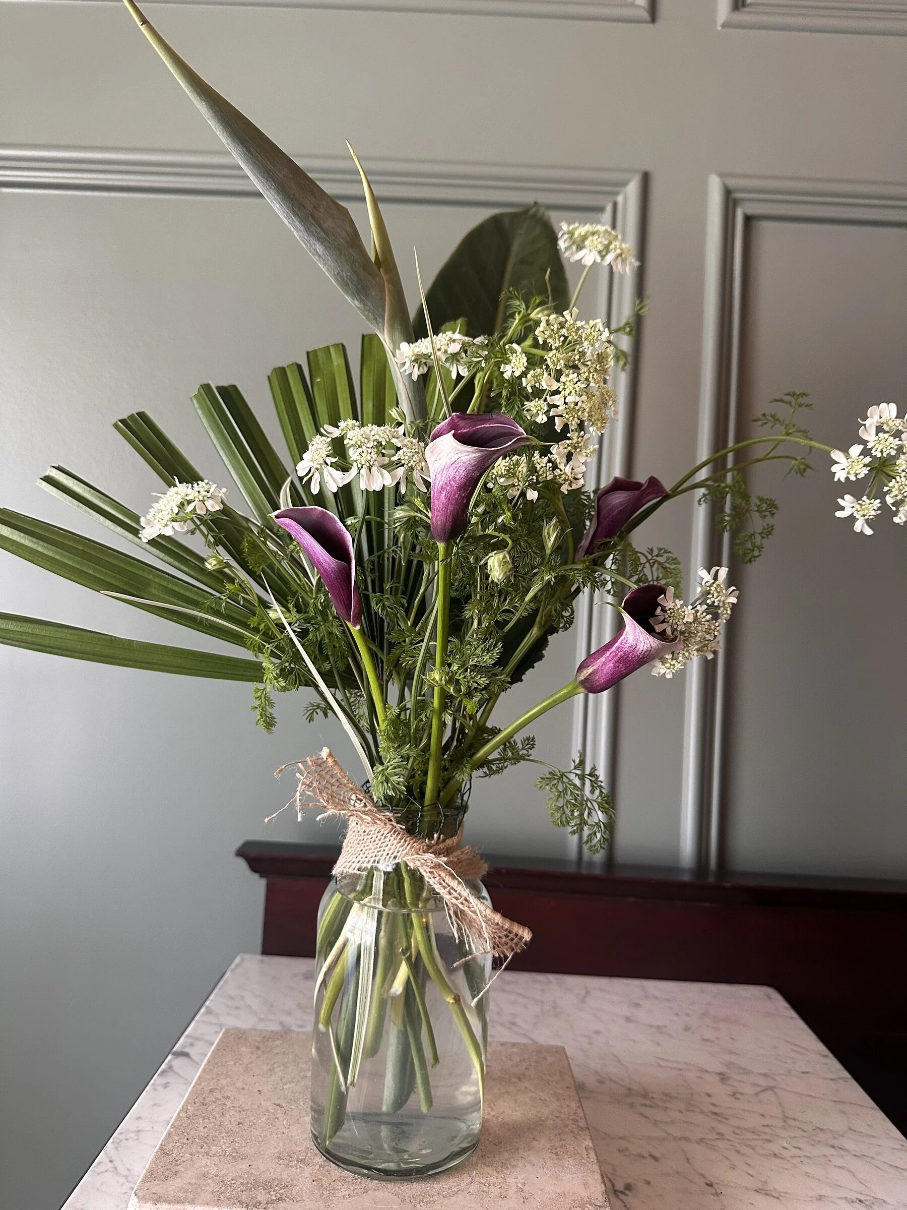 burlap-tied-jar-calla-lily-palm-frond-arrangement-cary-florist.jpg