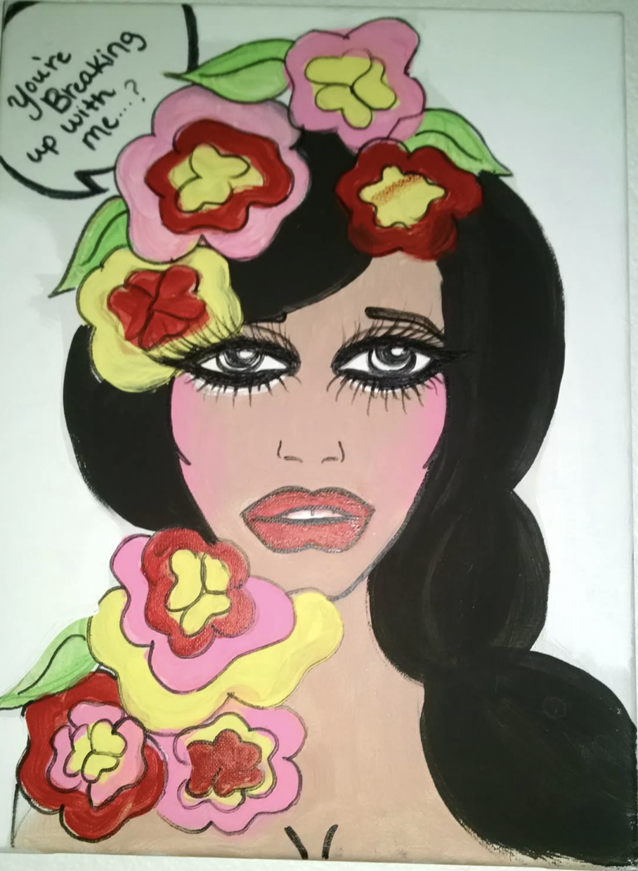 A drawing of a woman with black hair and makeup, surrounded by colorful flowers. She has an expression with lips slightly parted and is saying, 'You're breaking up with me?' in a speech bubble.