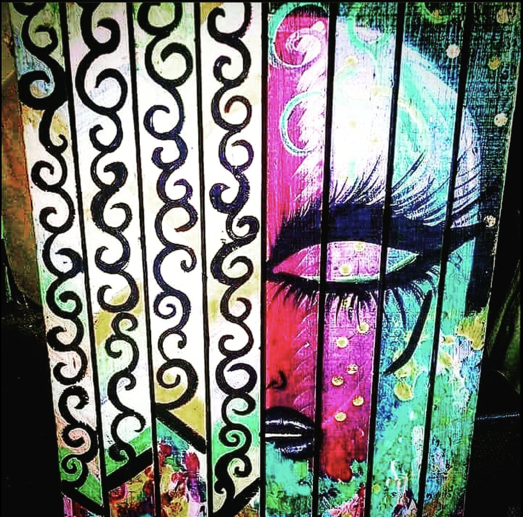 Colorful abstract artwork featuring vertical stripes with intricate swirling patterns and designs in bright pink, green, blue, yellow, and black.