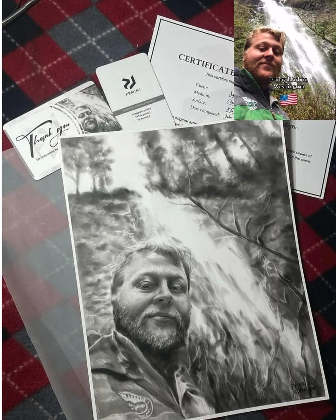 A black and white portrait of a man with a beard taking a selfie outdoors in front of trees and a waterfall. On the table, there are certificates, a business card, a thank you card, and a printed photo of the man.