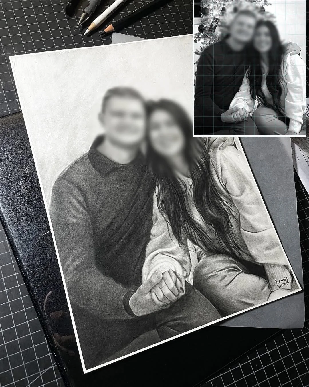 Black and white pencil drawing of a couple holding hands, with a blurred photo inset in the top right showing the same couple sitting closely together, posing for the camera.