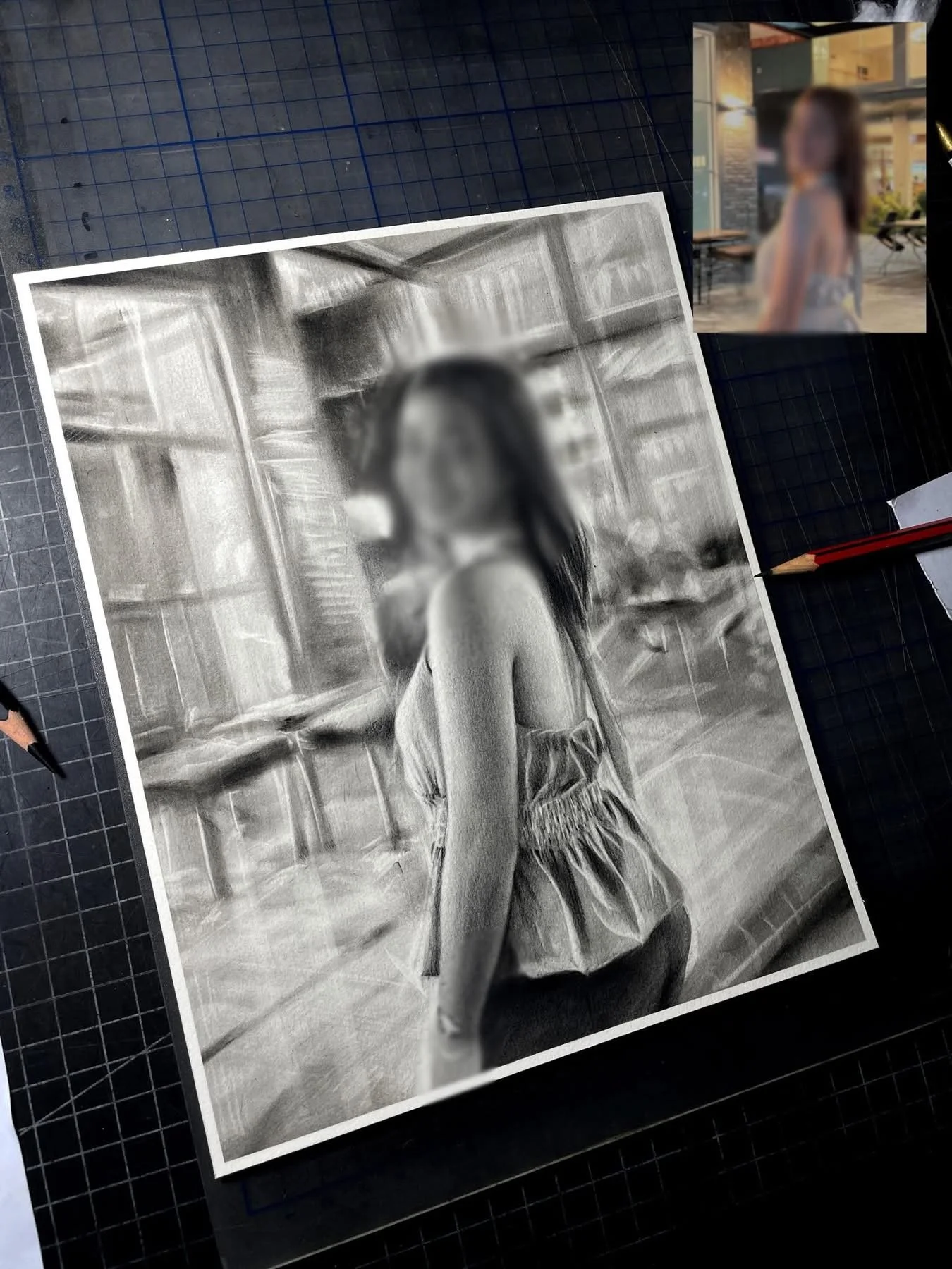A black and white photorealistic drawing of a woman sitting in a room with wooden walls, with her leg crossed over her knee. Her face is slightly blurred, and she appears to be wearing a sleeveless top and shorts.