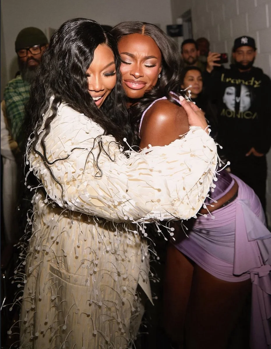 Brandy and Coco Jones interacting backstage during Boy Is Mine Tour cross-platform campaign