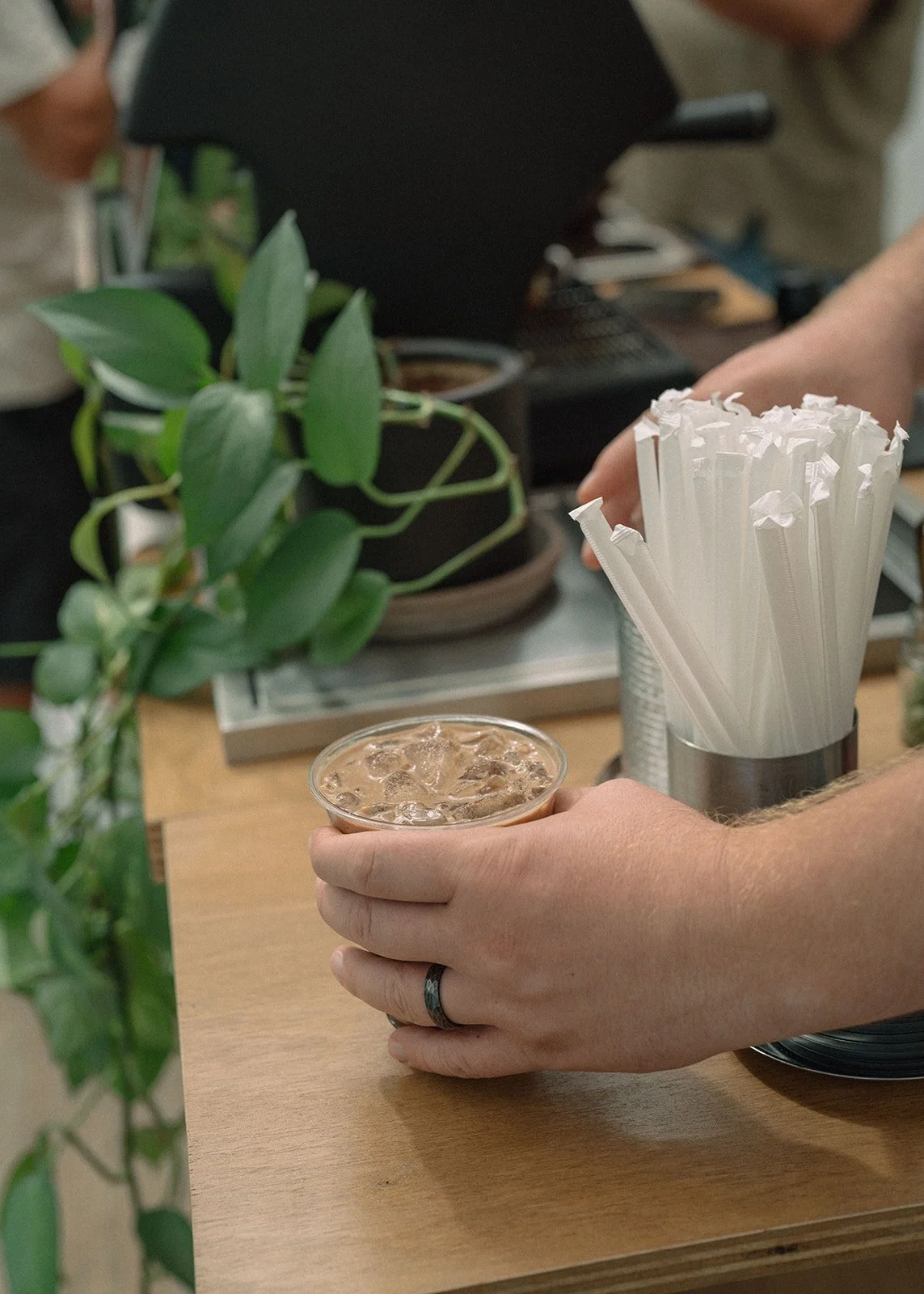 Barista preparing a specialty coffee drink at Halea Coffee cart