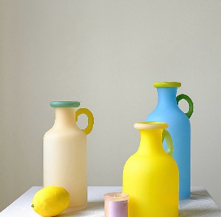 Inspired by the Fauvism paintings, these cute whimsical pitcher vases are mouth blown and hand painted with bold catchy colors, making them not only a a visual feast but also will uplift your mood. Its curved, artisanal form brings charm and personal