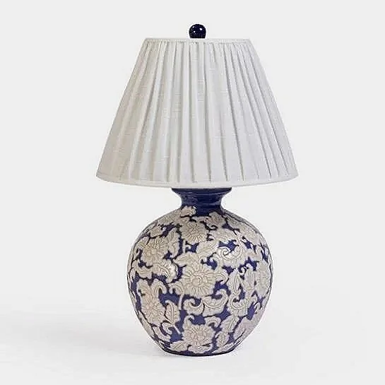 Like something collected over time from design-forward homes in Lisbon or along the coast of the French Riviera, this elegant lamp adds a refined, storied touch to a bedside, console, or side table.