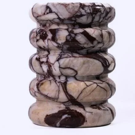 This marble vase from TOV captures that unmistakable European mood, where design feels collected. Carved from solid marble with rich, natural veining, it echoes the quiet sophistication of interiors in Milan and Paris.