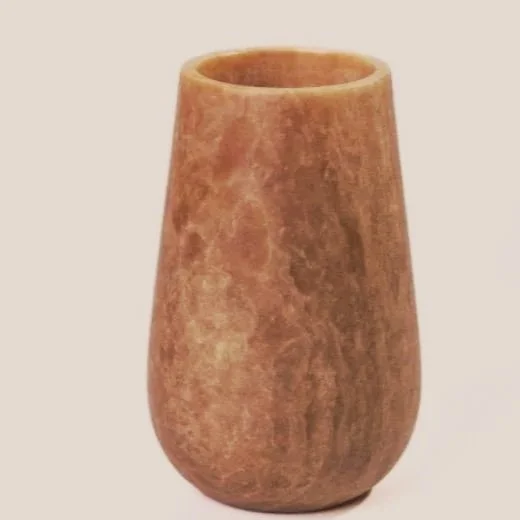 Carved from solid marble with dramatic natural veining, this vase reminds one of a refined, understated, collected work of art, grounding your space with depth, character, and a quiet, sculptural edge that elevates without ever trying too hard.