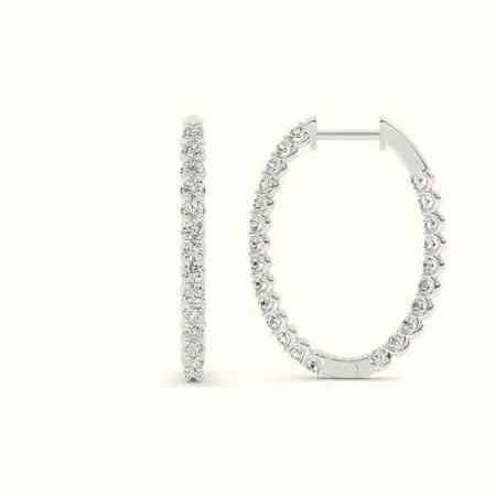 A modern take on a classic silhouette. The soft oval shape elongates the line of the face, while delicate diamonds add just the right amount of light.
Refined without feeling rigid, these hoops move effortlessly from day to night, never overpowering,