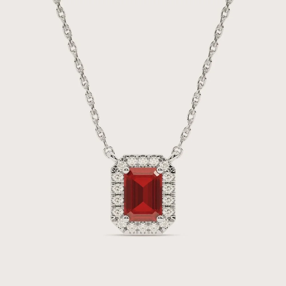 A vivid center of ruby, surrounded by a soft halo of light. Bold in color, yet refined in execution, this piece balances richness with restraint.
The deep red stone carries presence, while the surrounding diamonds keep it luminous and wearable.
It fe