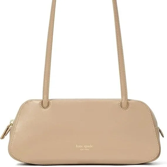 Long, lean, and quietly striking, the Grace shoulder bag embraces the elegance of an east-west silhouette. Crafted from fine leather, it rests close to the body with effortless fluidity, carrying just enough while saying everything. Understated, refi