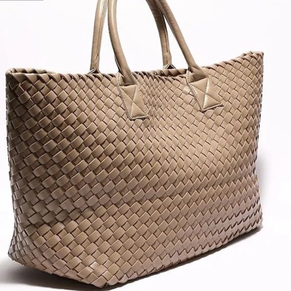 Designed for days that don’t stay in one place. This woven shopper carries it all with quiet composure. The textured finish adds depth, while the silhouette remains relaxed and unforced. A travel companion that feels just as right in motion as it doe