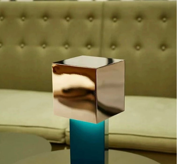Transform the vibe of your room and add a touch of whispering sophistication to your space with this Bauhaus-inspired geometric metal pivot dimmable lamp. Featuring a blend of vivid colors and geometric shapes, this futuristic cubic metal modern port