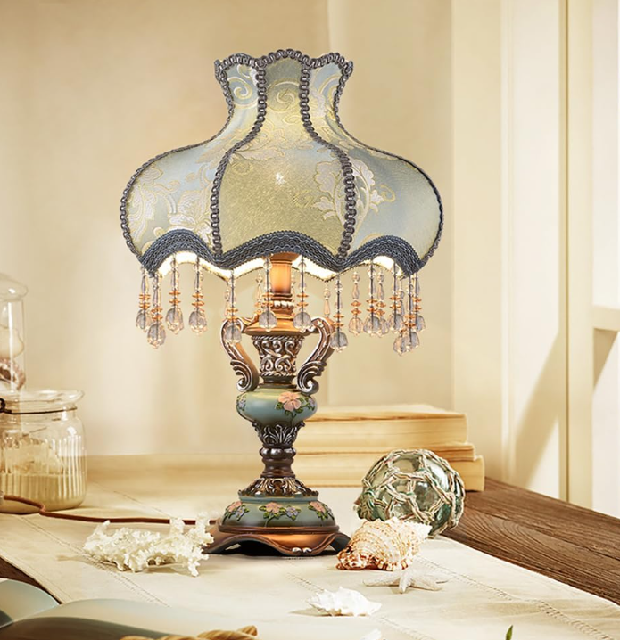 Aeyee Antique Floral Table Lamp

With its delicate floral details, soft blue finish, and elegant fabric shade, this table lamp brings a romantic European touch to bedside tables, reading corners, and living spaces. Inspired by vintage interiors, its 
