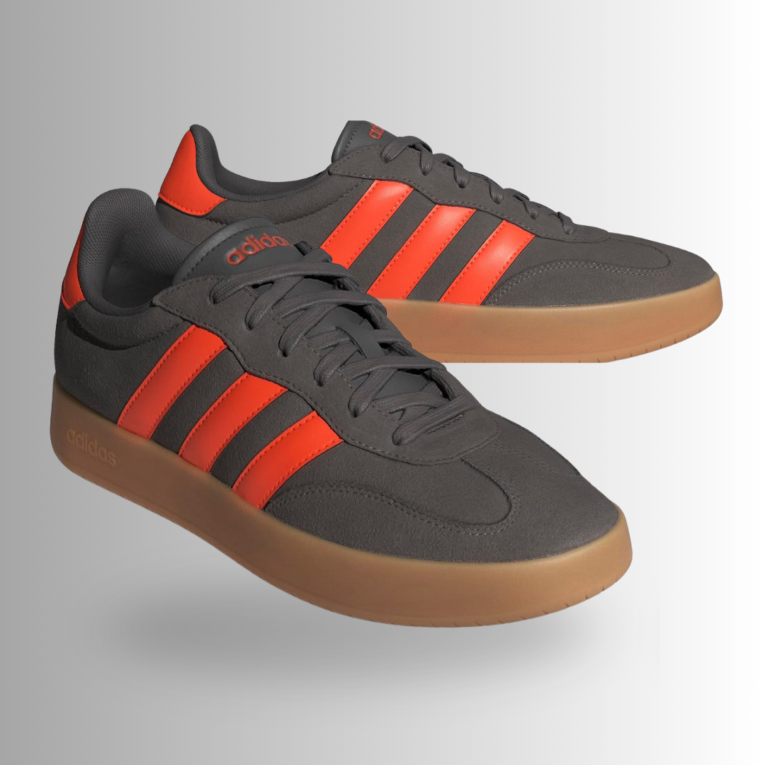 This Adidas Men's Barreda Fashion Sneaker features a distinct Charcoal, Impact Orange, and Gum colorway. It combines a classic athletic silhouette with a modern, streetwear-ready edge, making it highly versatile for casual wear.