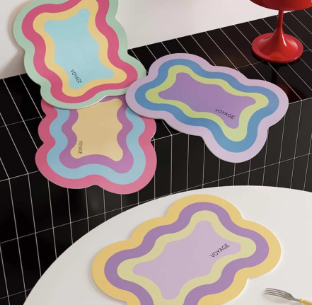 4 scalloped edge place mats designed to bring a playful pop of color to your table. Their vibrant, dopamine inspired hues and gently curved trim add a cheerful, whimsical touch, perfect for mixing and matching within an eclectic table setting. Not on