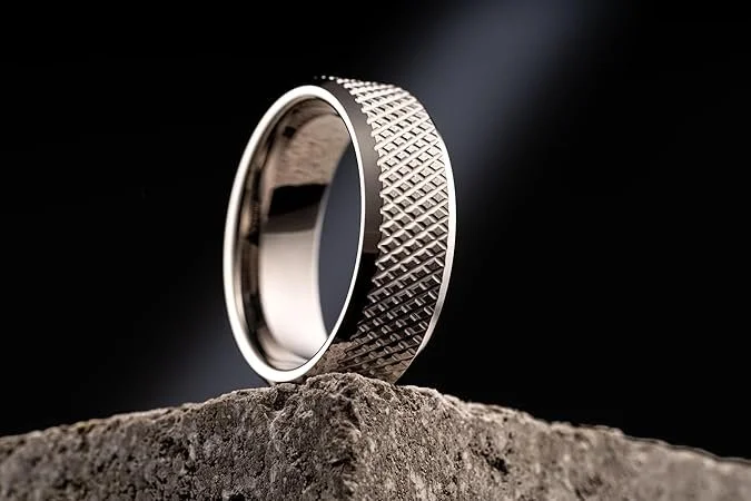 A ring defined by precision and structure. Crafted from tungsten with a knurled diamond pattern, it brings a technical, architectural edge to a timeless form. It’s a piece that feels aligned with modern masculinity: disciplined, composed, and unafrai
