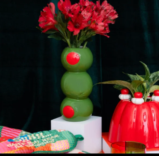 A playful ceramic vase shaped like stacked martini olives, equal parts nostalgic and novelty. A quirky, conversation starting piece for a shelf or table already full of personality.