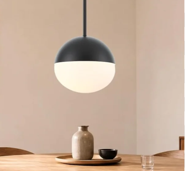 The ELYONA pendant light pairs a milky white glass shade with matte black metal, creating a balanced look for modern, bauhaus, natural, farmhouse, transitional, and minimalist interiors. 