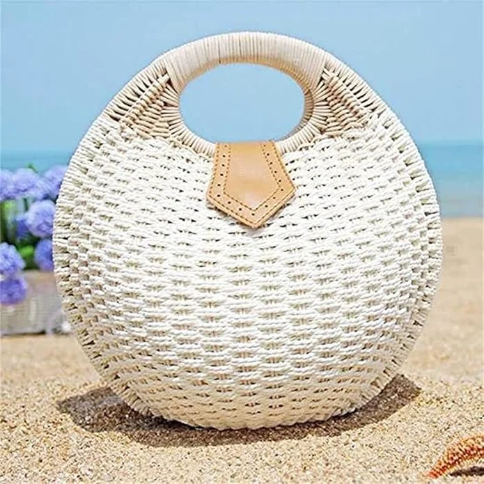 This hand woven straw shell bag leans into that effortless summer elegance so often found along European coastlines. With its sculptural shell-inspired silhouette and circular handle, it feels both nostalgic and refined. Light, textured, and distinct