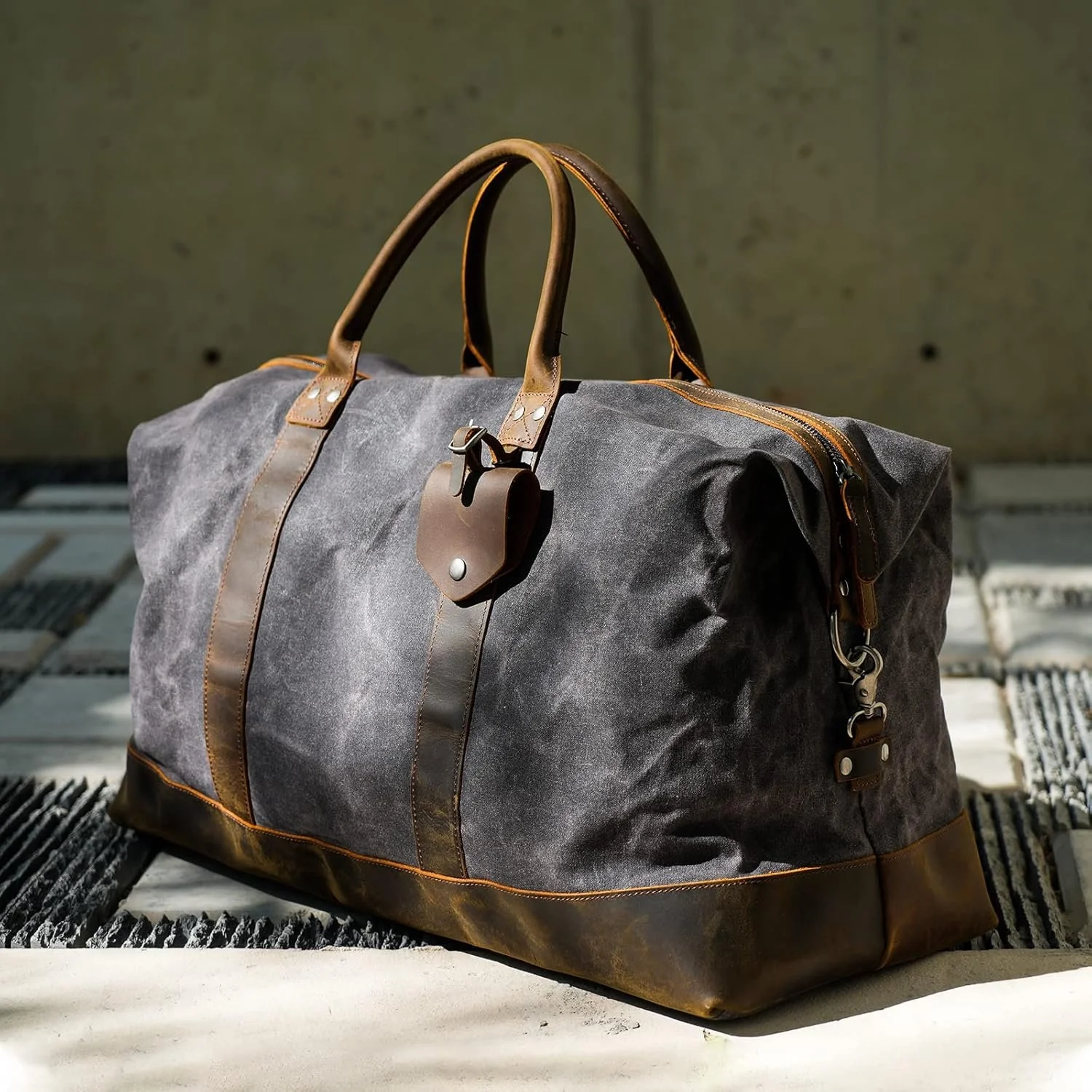 Whether carried through city streets or packed for a quick departure, the Polare Duffel Bag (in Grey) reflects a wardrobe that values substance and ease. This duffel offers a refined balance of strength and texture, built to handle both daily use and