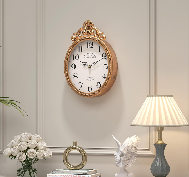 Abdurey French Oval Wall Clock

Inspired by classic French interiors, the Abdurey Oval Wall Clock brings quiet elegance to any room. Its timeless oval silhouette and vintage character make it equally at home in a country farmhouse, a Parisian-inspire