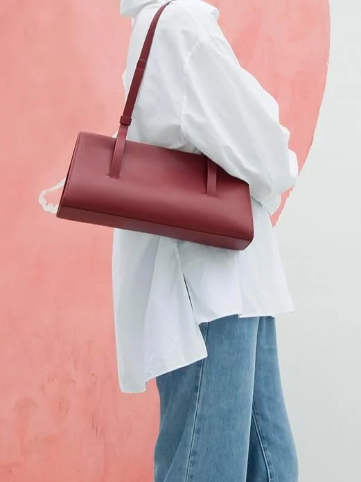 DONNAIN Genuine Leather East West Shoulder Bag 
A refined touch of colour, this genuine leather shoulder bag in red wine carries that quietly confident European mood; rich, understated, and never overly bright. Crafted in soft natural leather with a 