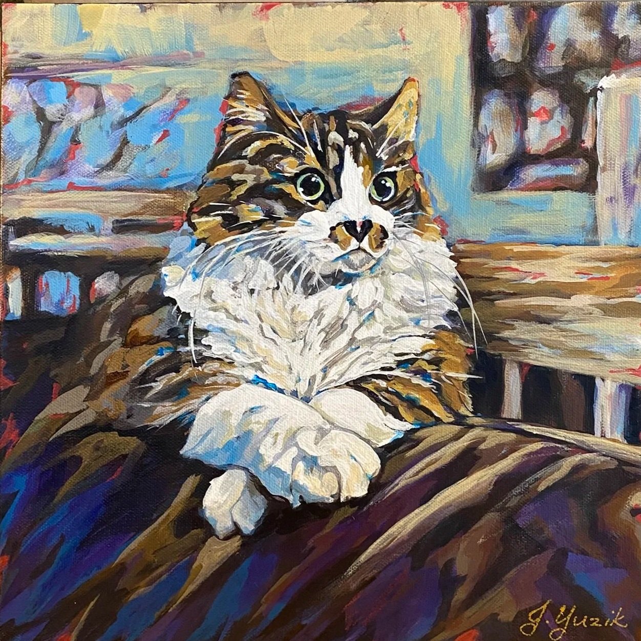 A colorful painting of a tabby and white cat with green eyes, lying on a bed with a wooden headboard. The background features abstract artwork and a framed poster or photo.