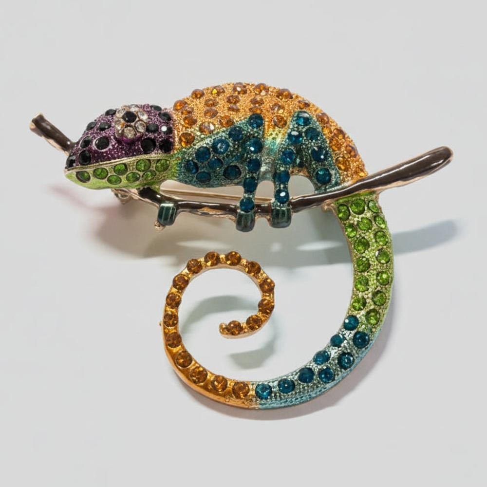 Colorful chameleon brooch on a gray background