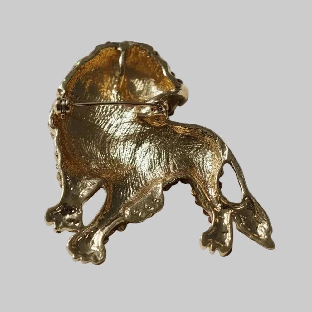 Back view of pink rhinestone lion brooch