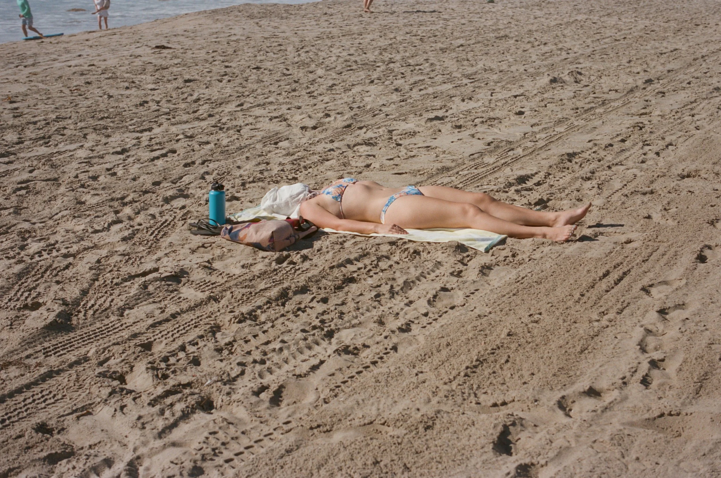 Manhattan Beach, California - February 2026 - covered bather