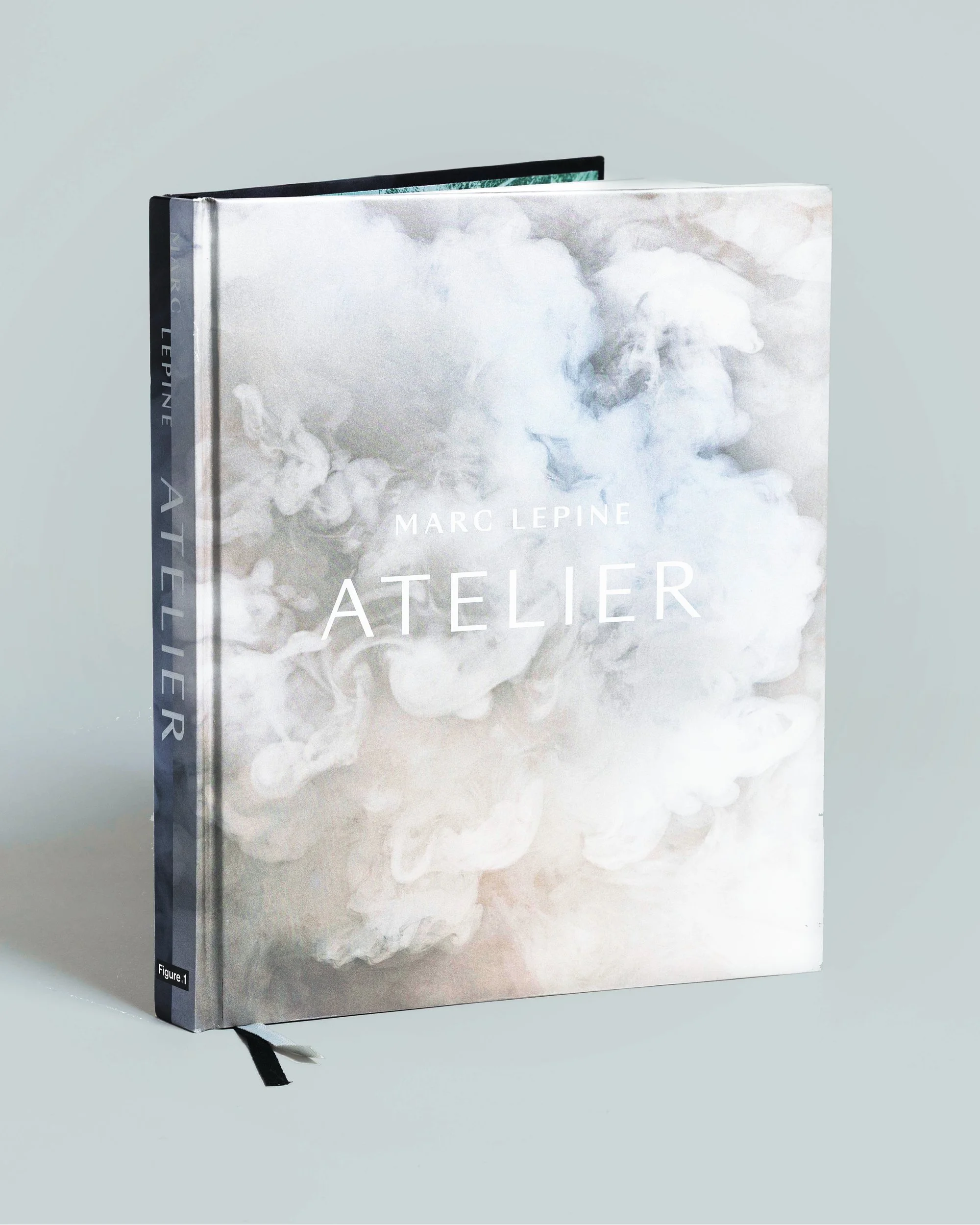 Atelier cookbook cover desig for chef Marc Lepine, white cloud photography with debossed foil title