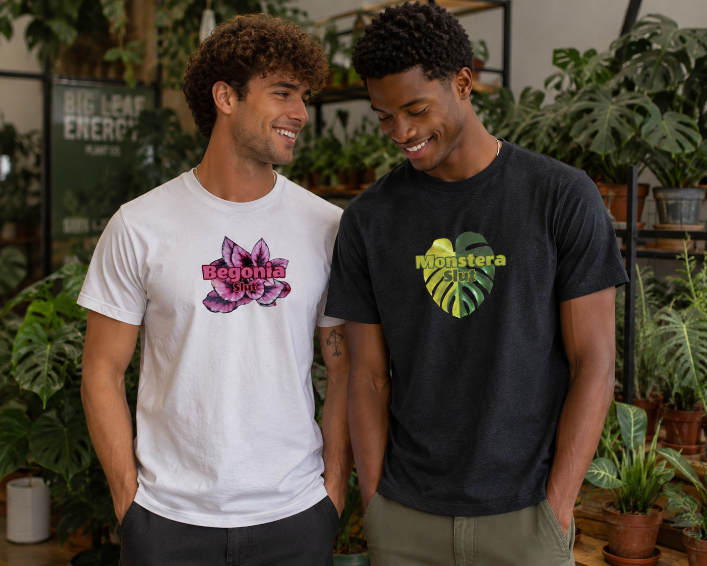 Two young men standing in a plant shop, smiling, wearing styled T-shirts with humorous plant-themed texts and graphics, surrounded by lush houseplants.