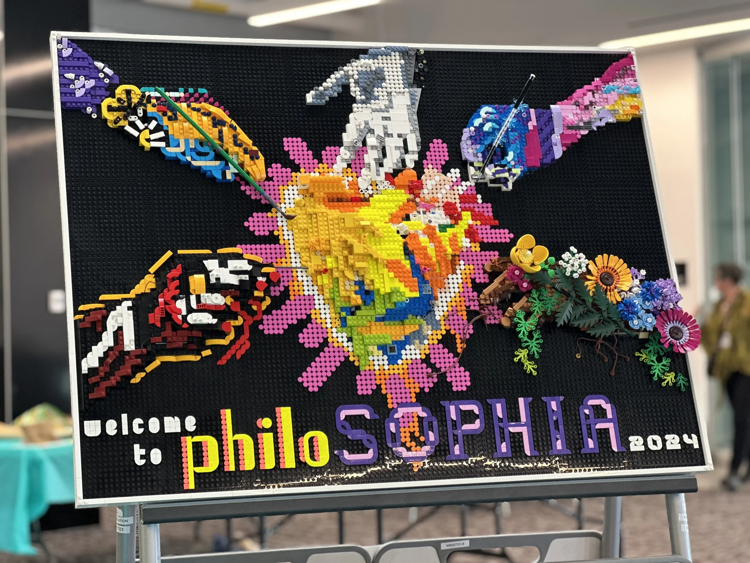 A large LEGO sculpture depicts the book cover. Bailey Szustak designed and created the art and this LEGO sculpture.