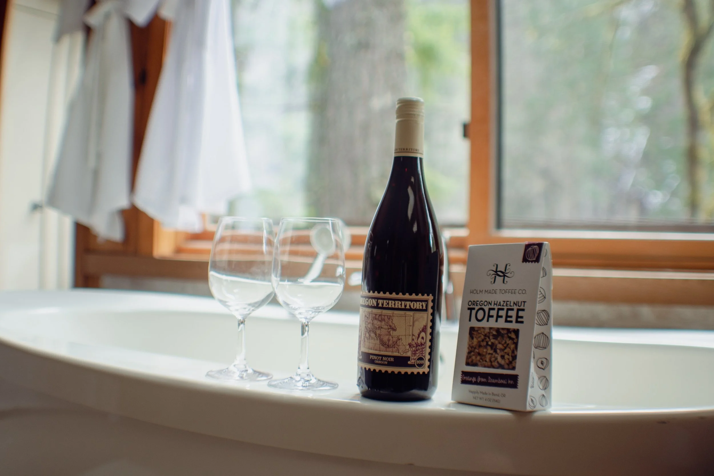 enjoy complementary oregon pinot noir wine and toffee in your soaking tub
