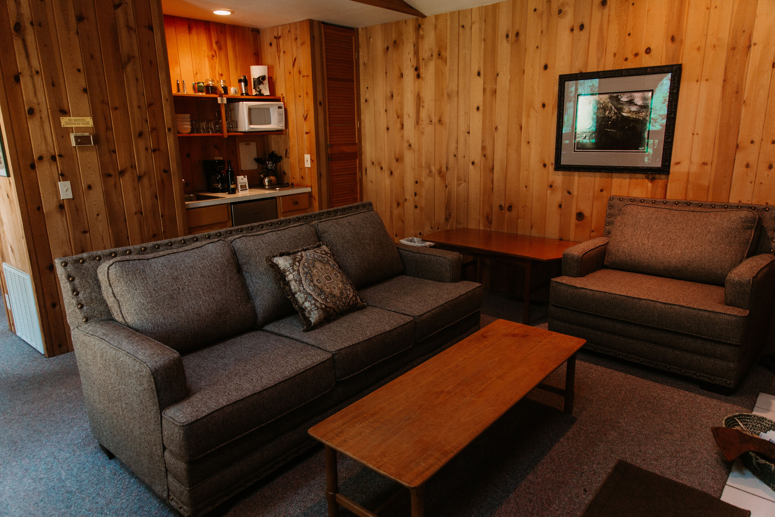 private living area and kitchenette at the falls suite