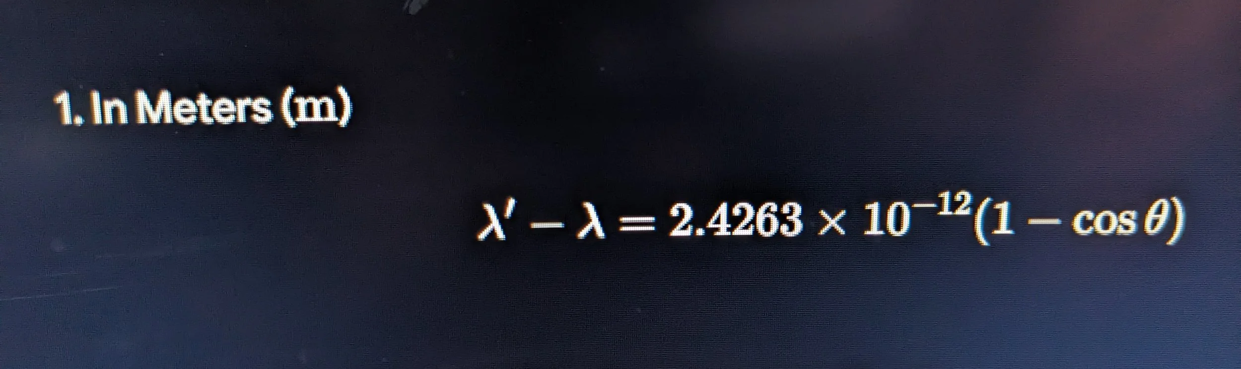 Mathematical formula showing the difference of wavelengths in meters, involving an exponential expression with base 10 and cosine of an angle.